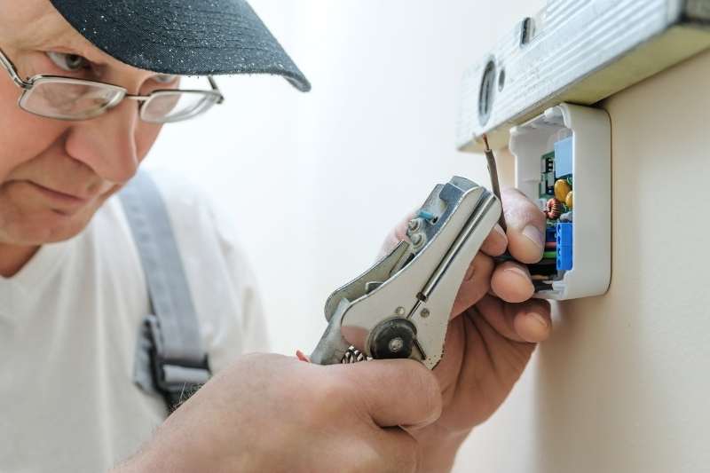 man installing property technology