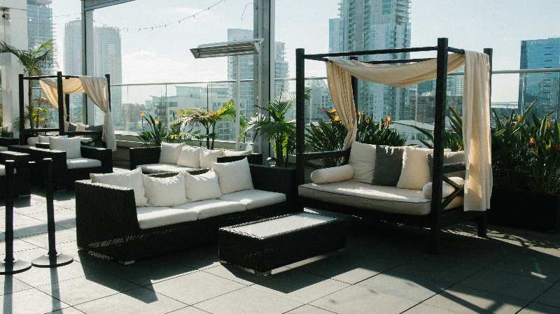 sofas on rooftop shared apartment amenity