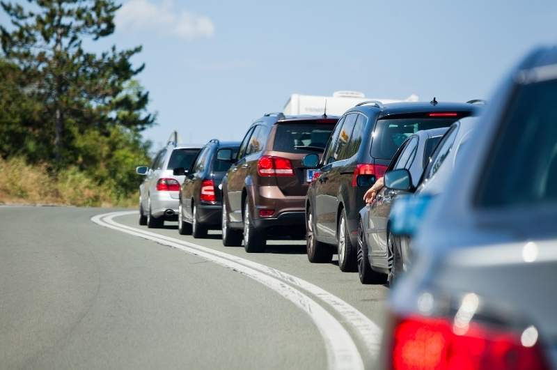 traffic jam causes tailgating at gated community