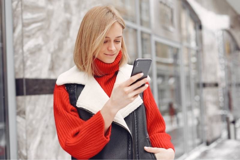 millennial using video intercom for condo with smartphone