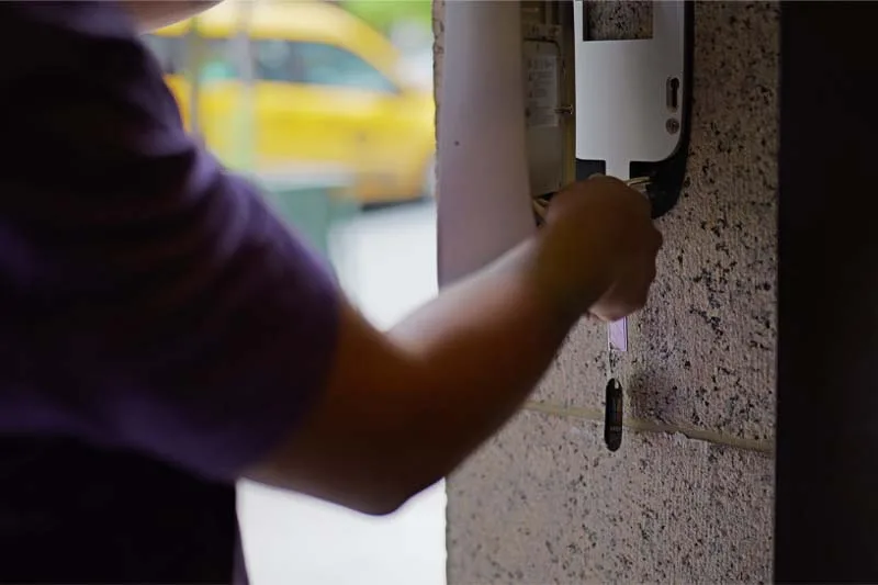 Installer secures the ButterflyMX Video Intercom