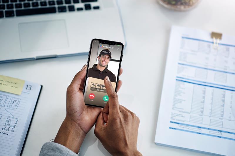 tenant letting package delivery driver in with ButterflyMX mobile app