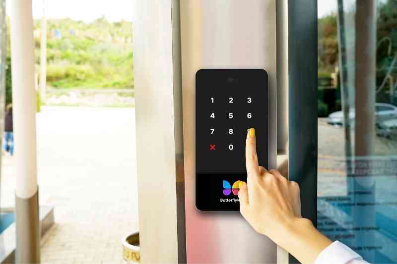Using a keypad to open a door.