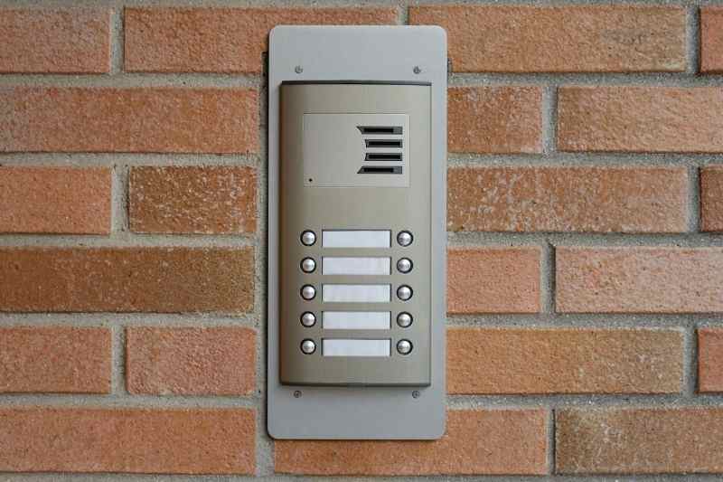 door call box on brick wall