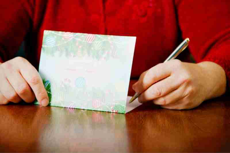 property manager writes holiday cards to staff and residents