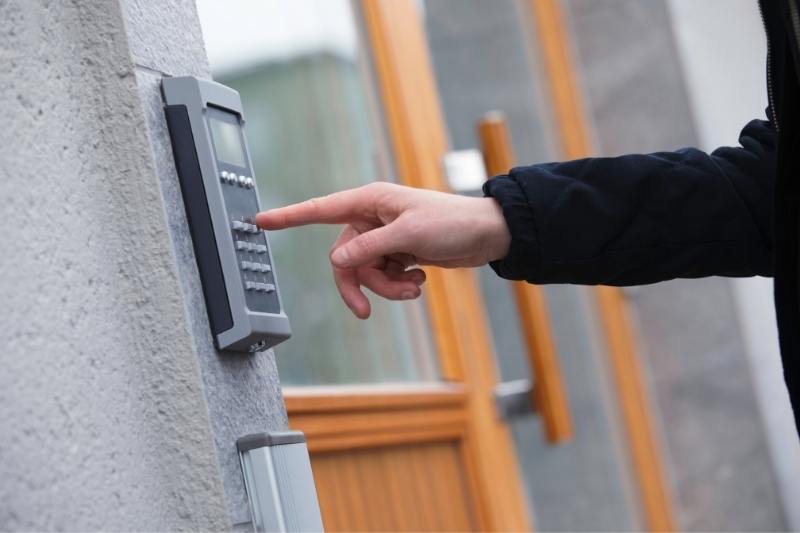 man using door phone system to contact resident