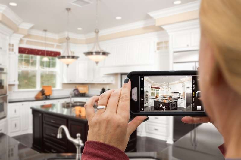 taking photos for virtual apartment tour with phone