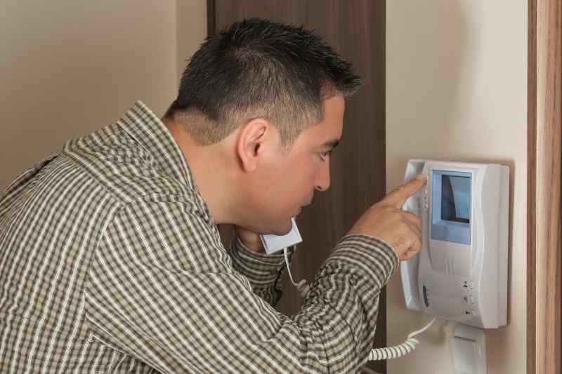 resident using wireless video door phone