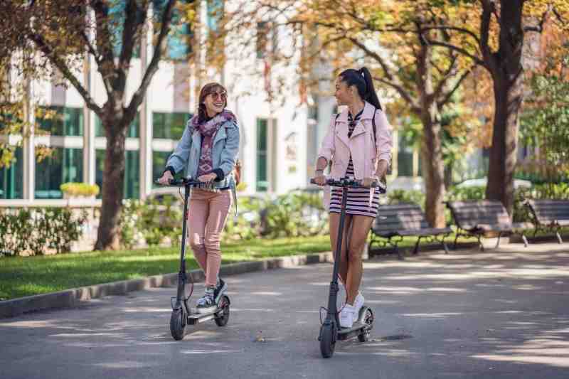 city residents enjoying micromobility on scooters