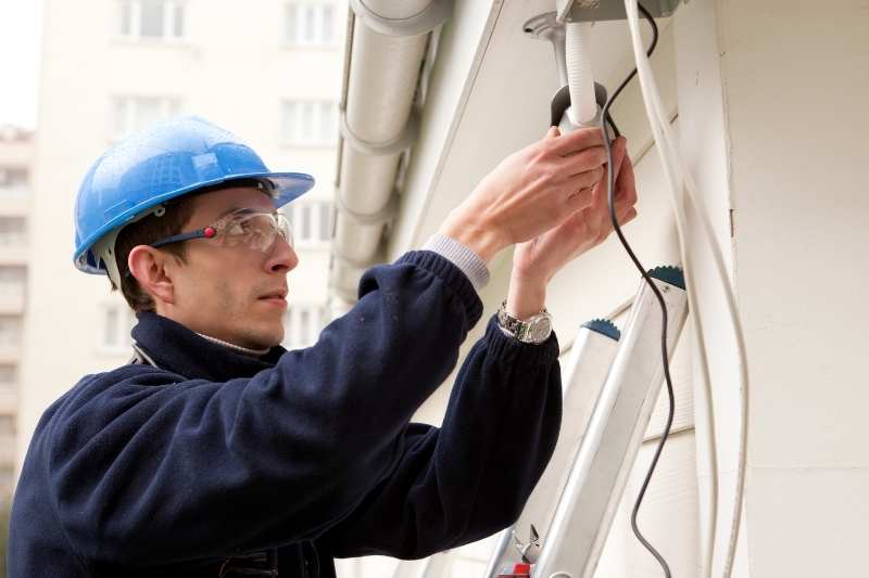 security system installers working at building