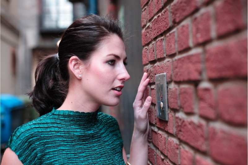 visitor uses an IP door phone to call resident and request access