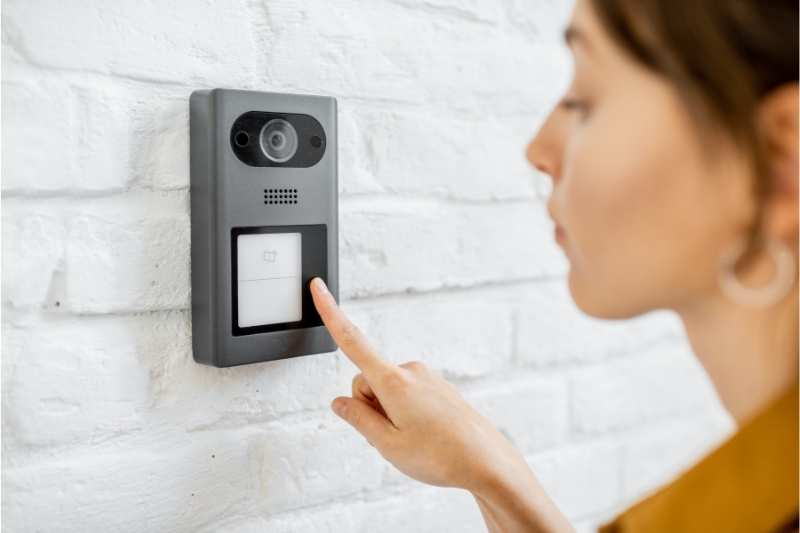 visitor using a video intercom doorbell