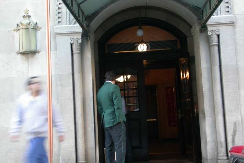 traditional doorman at apartment building