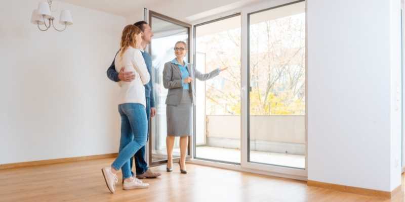 a property manager leads a prospective resident on a tour