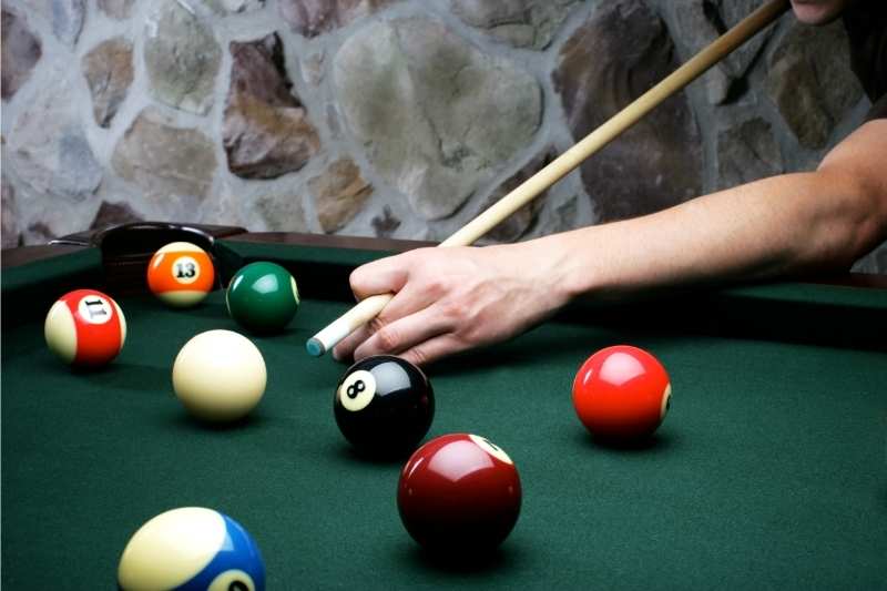 a pool table in a community room is a great student housing amenity