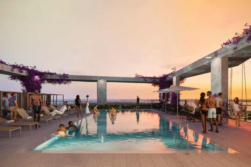 Residents relax at Heron Water Street's rooftop pool.