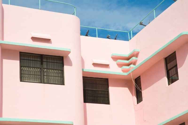 Pastel pink building with intercom in Miami.
