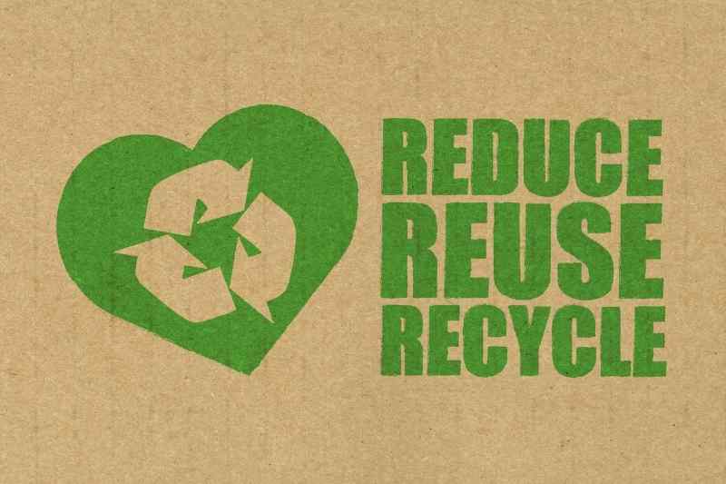 reduce, reuse, recycle written on cardboard