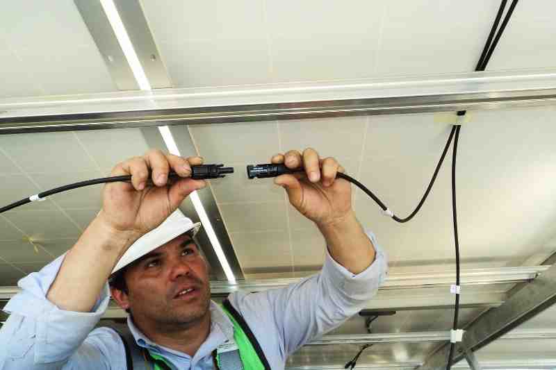Technician installing intercom the complies with TDPA