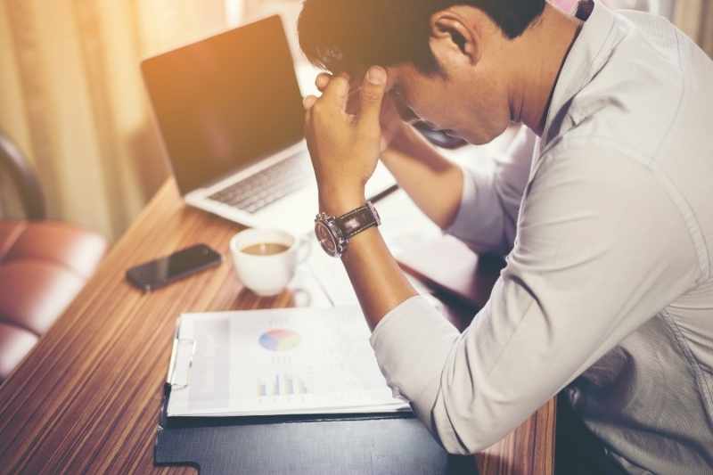 property manager burnout at his desk