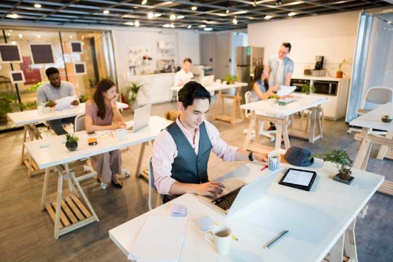 workers hot desk in a smart office building