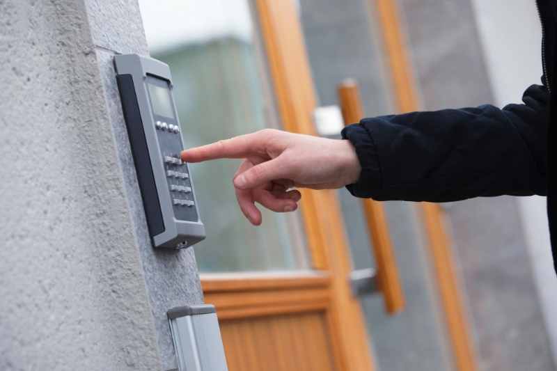 Guest calls a resident using a door phone entry directory.