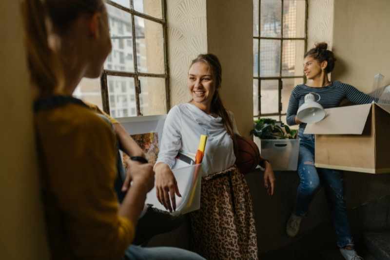 Tenants relax in a dorm built using new student housing design trends.