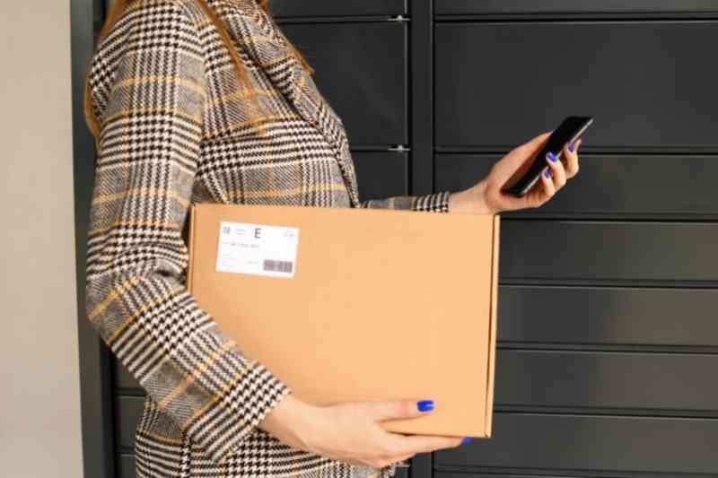 Checking package delivery alerts on smartphone.