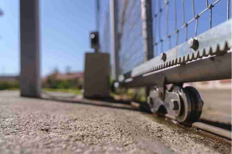 wheels of sliding gate with electric gate opener