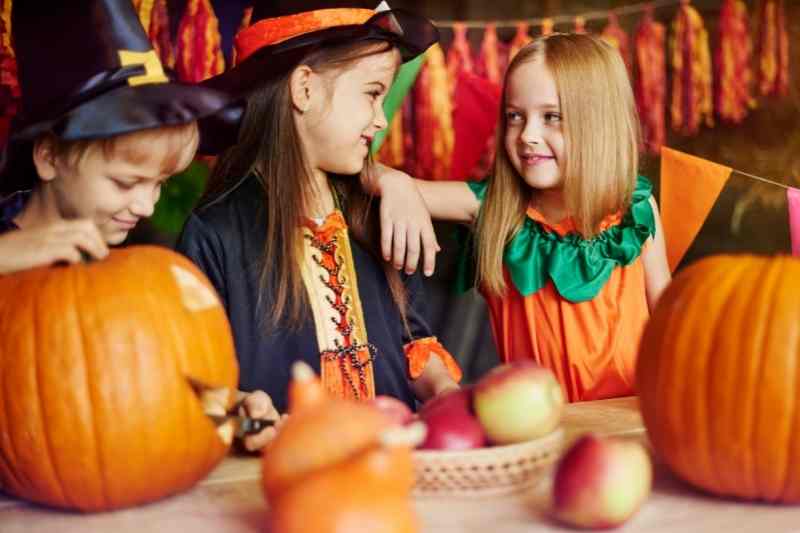 fall resident events kids pumpkin carving with costumes