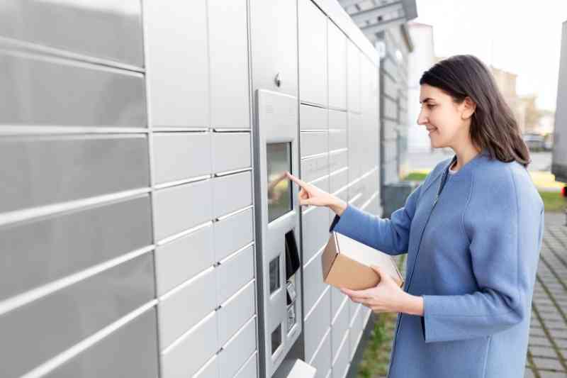 Receiving parcel from self-service machine.