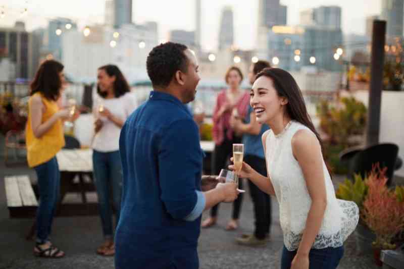 Residents socializing on rooftop.