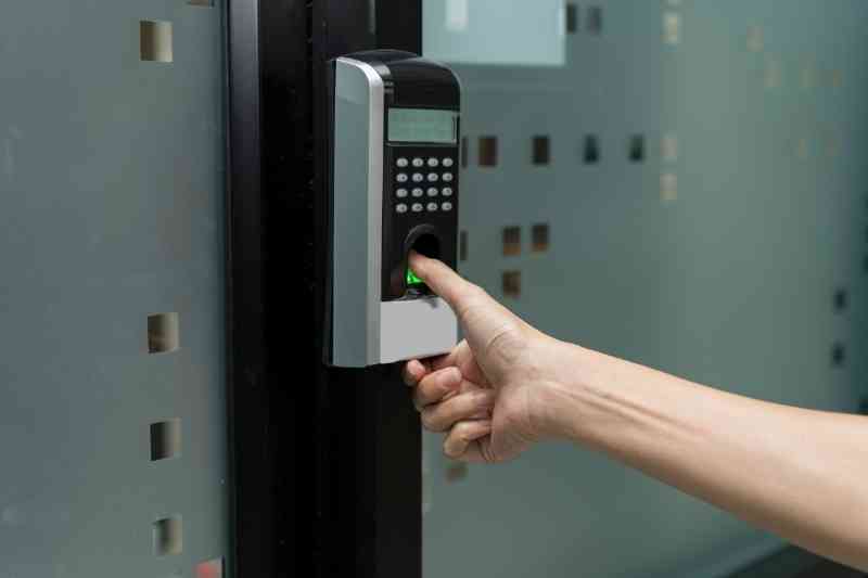 Using fingerprint lock to open door.