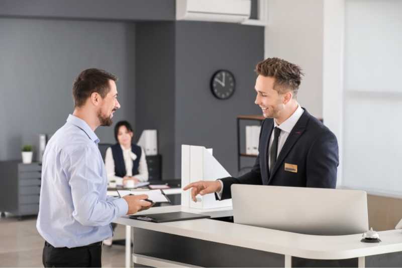 visitor checking in at guest management