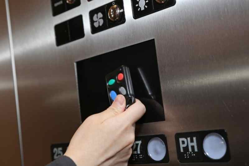 Resident scans a key fob at an access control reader