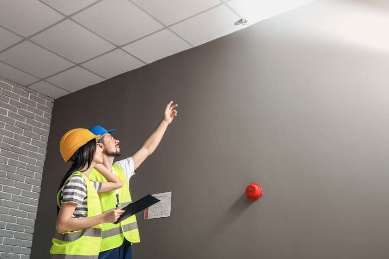 employees inspecting apartment safety