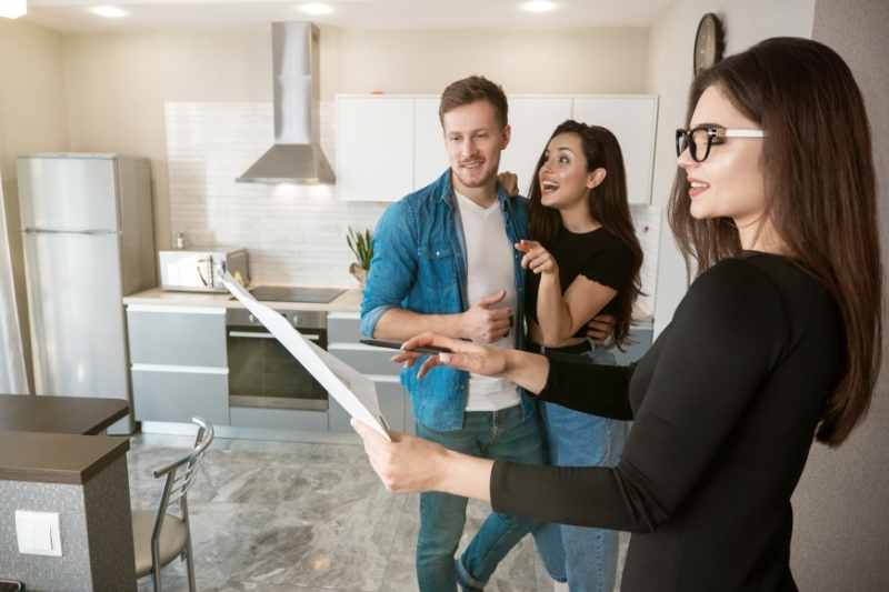 Condo property manager speaks with condo owners.