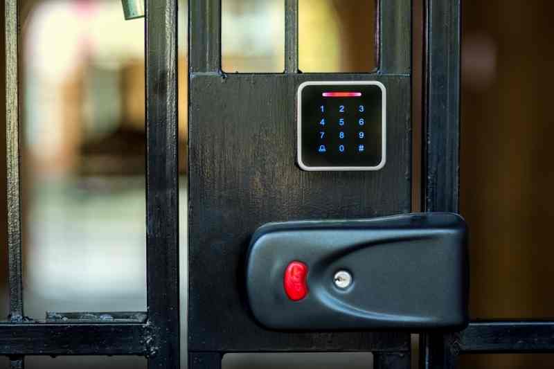 Digital keypad lock on a gate.