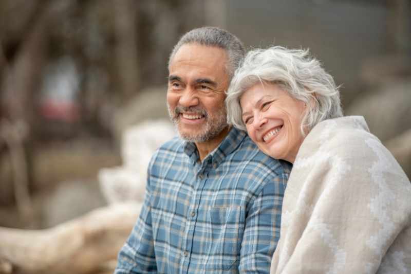 Two senior residents relax at a senior housing facility.