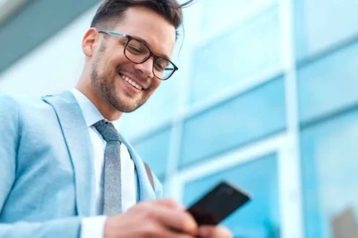 man smiling using a tenant experience app