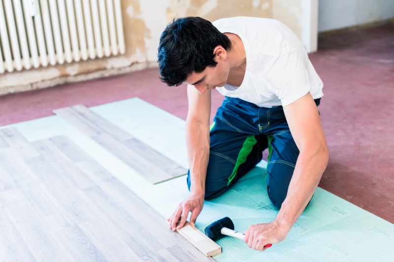 man installing renter-friendly flooring