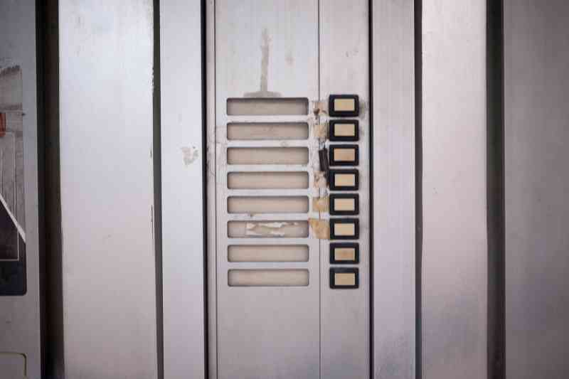 Old door buzzer in Chicago that needs repair.