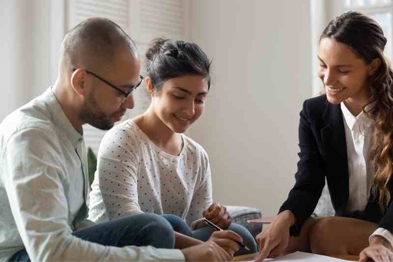 leasing agent signs a lease with new renters who used kelsey by zuma during the leasing process