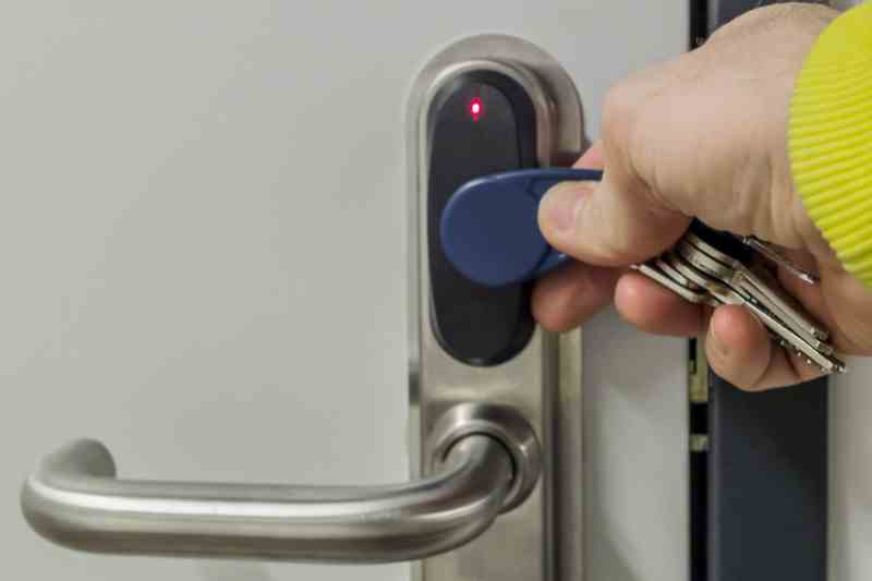 Using a key fob to open a commercial keyless door lock.