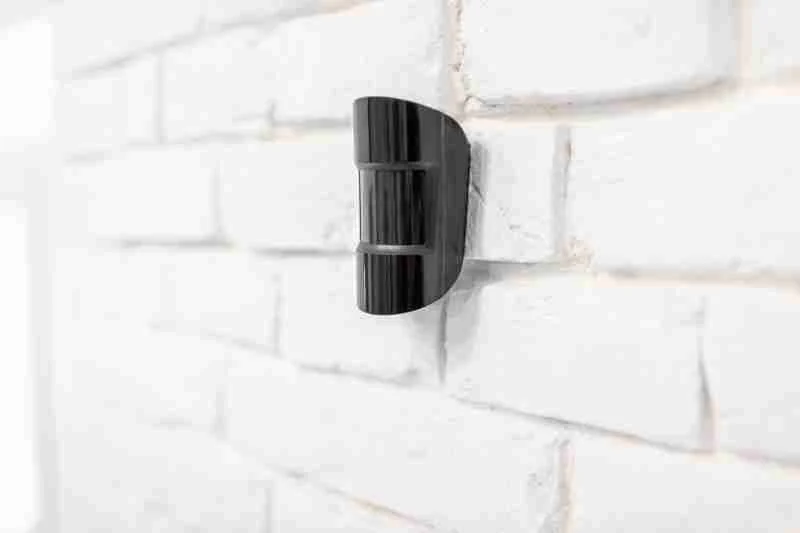 motion sensor alarm attached to wall