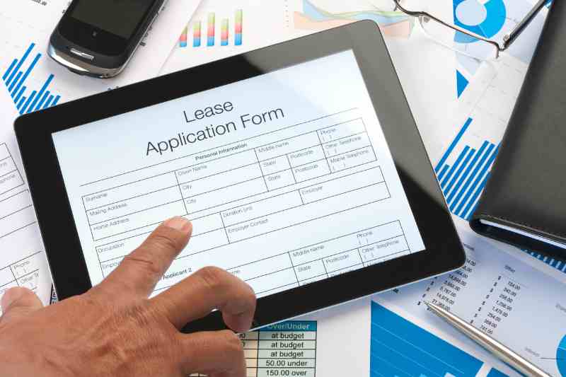 Filling out a virtual leasing application form.