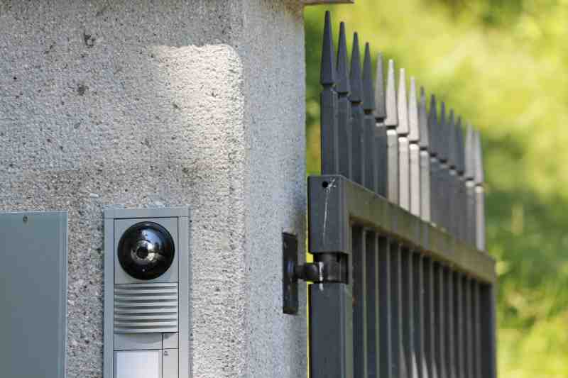 An electric gate with a camera.