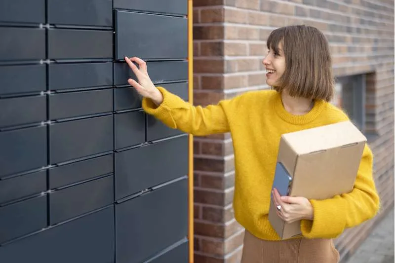 woman retrieving package from ParcelPoint smart locker