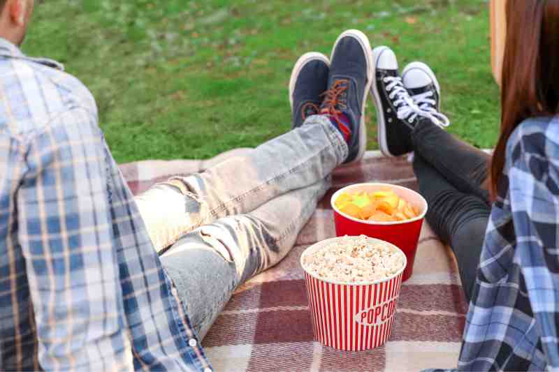 Residents watching an outdoor movie as a apart of spring resident events.