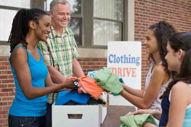 Residents collecting donations for a spring resident events clothing drive.
